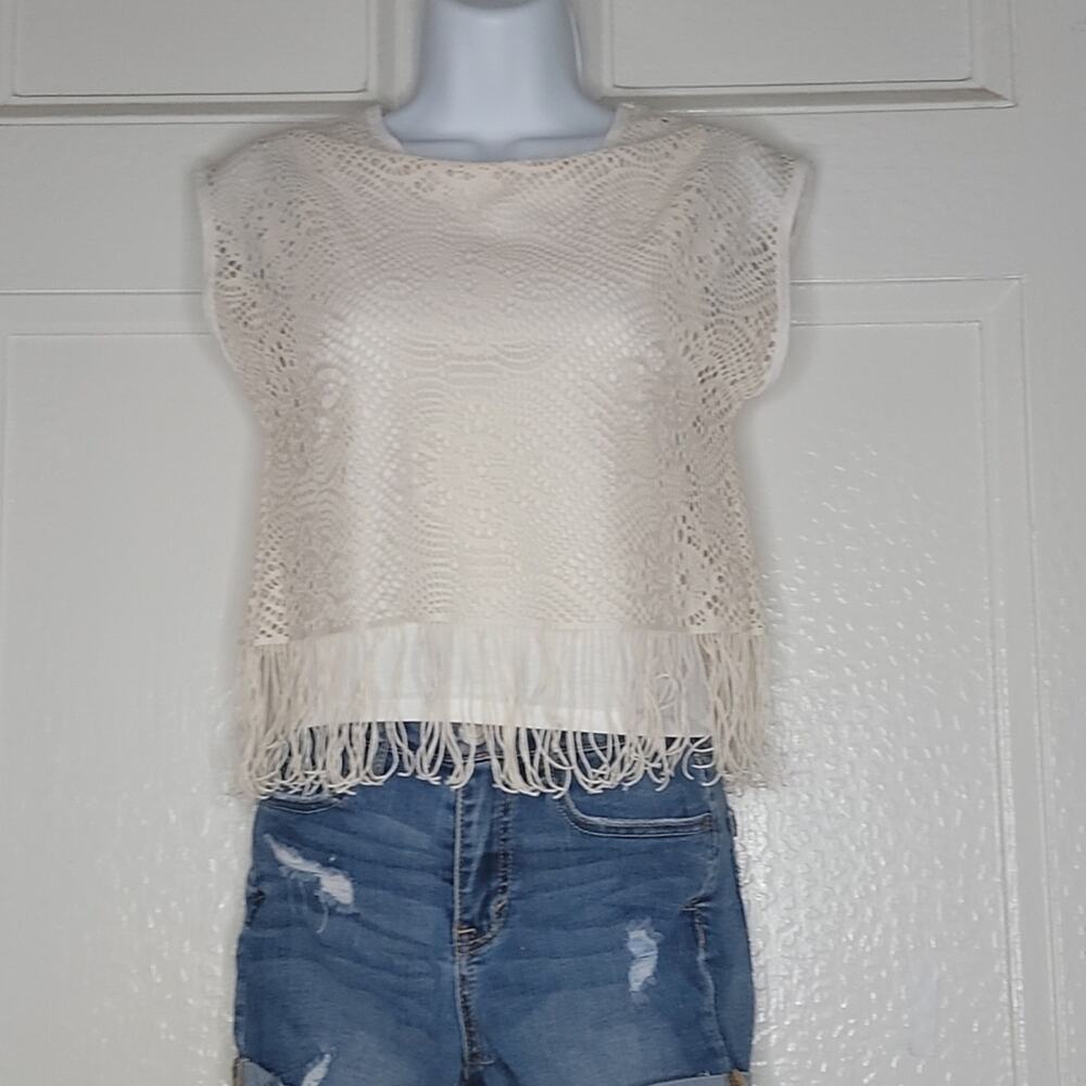 Girl's cream colored see threw lace top with matching attach shirt underneath